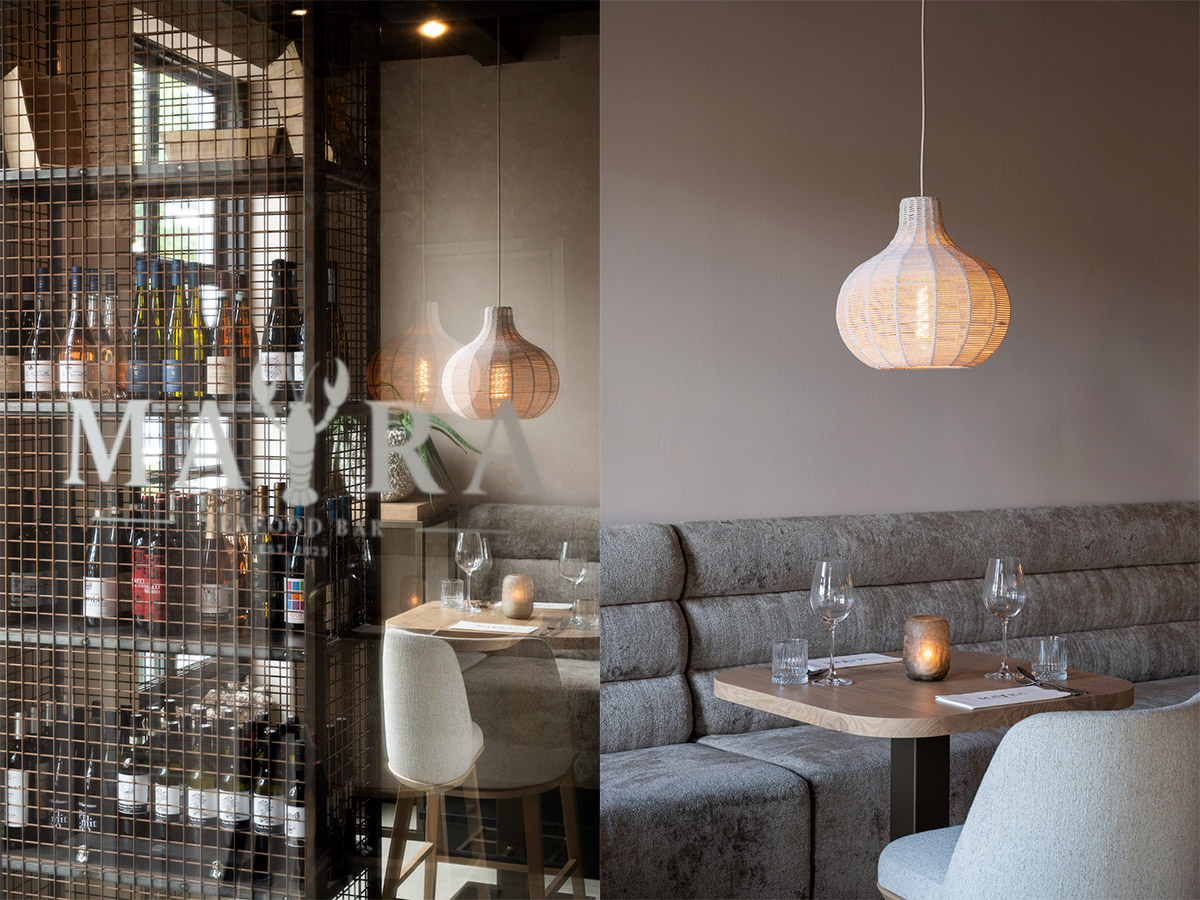 Straluma projectverlichting in Mayra Seafood Bar met sfeervolle rotan hanglamp en stijlvol restaurantinterieur
