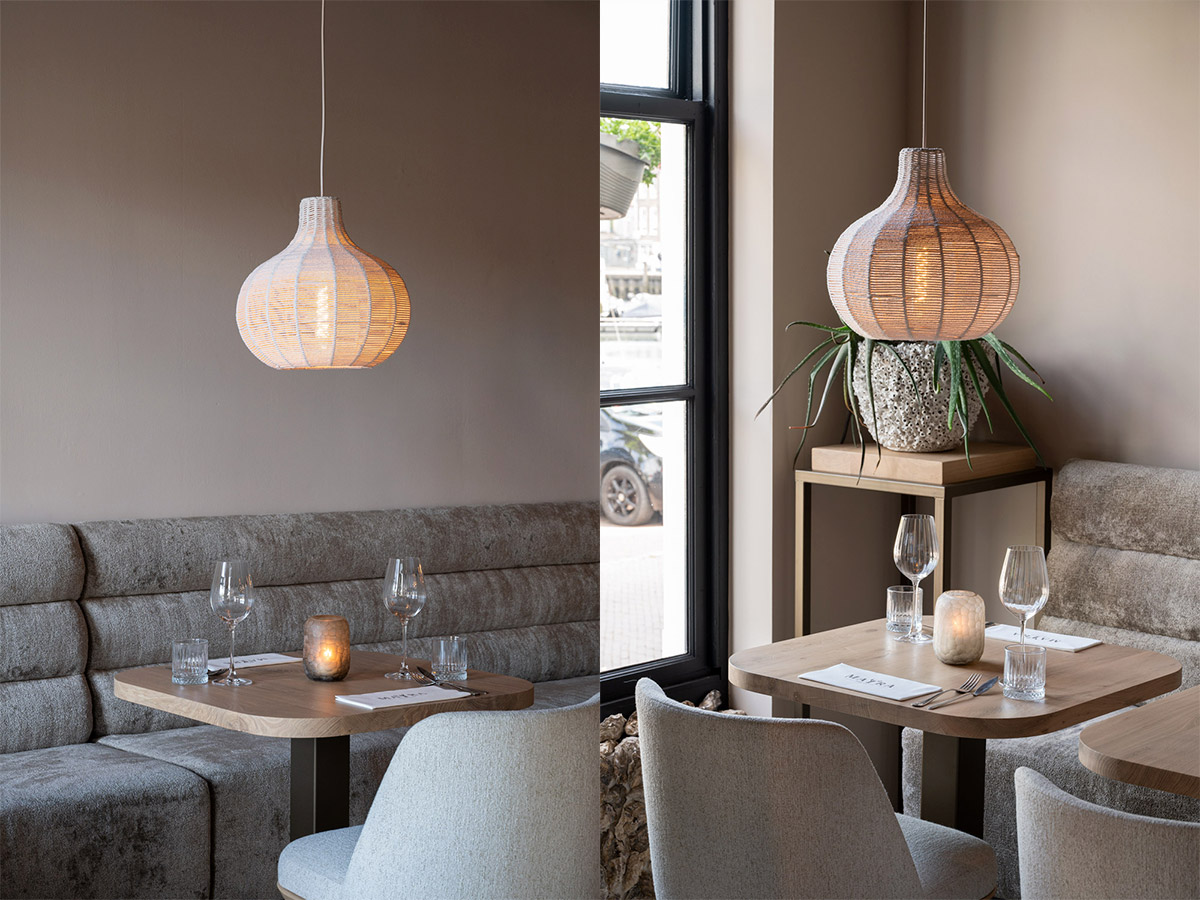 Straluma projectverlichting in Mayra Seafood Bar met sfeervolle rotan hanglamp boven restauranttafel