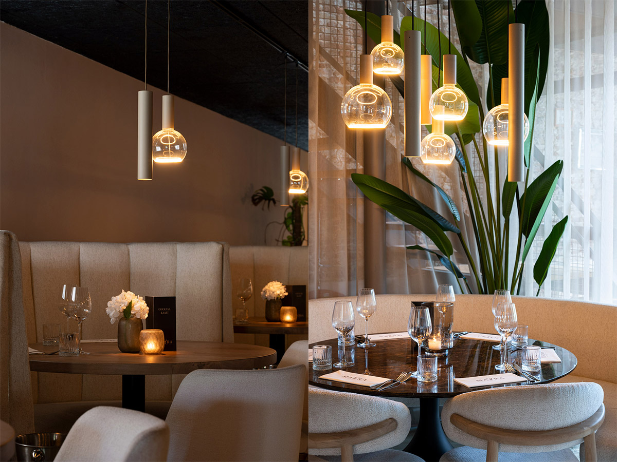 Straluma projectverlichting in seafoodbar met design hanglampen en warme sfeerverlichting boven restauranttafels